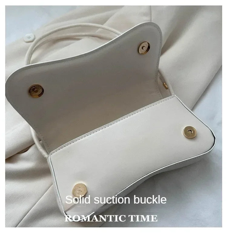 The Ivory Curve Shoulder Bag