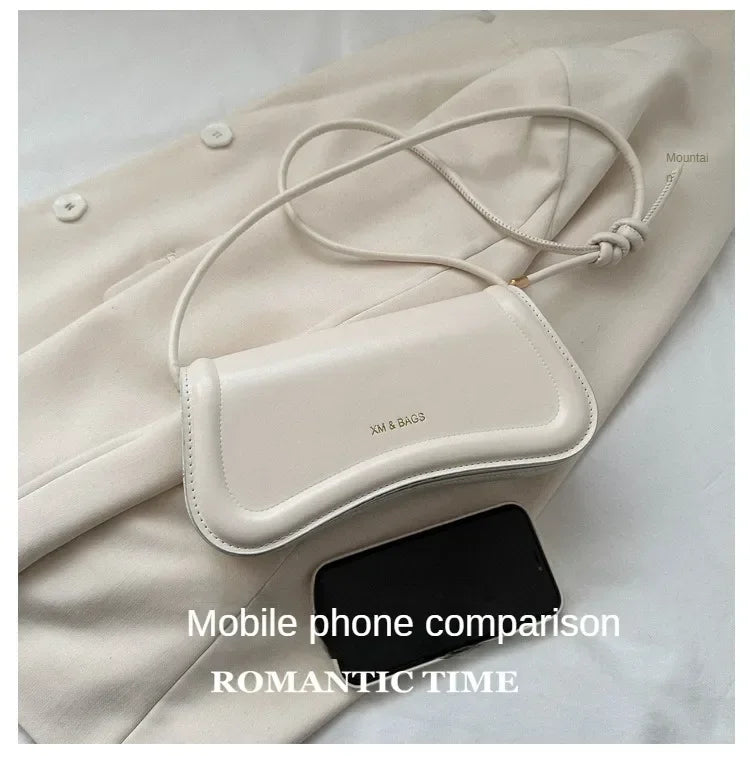 The Ivory Curve Shoulder Bag