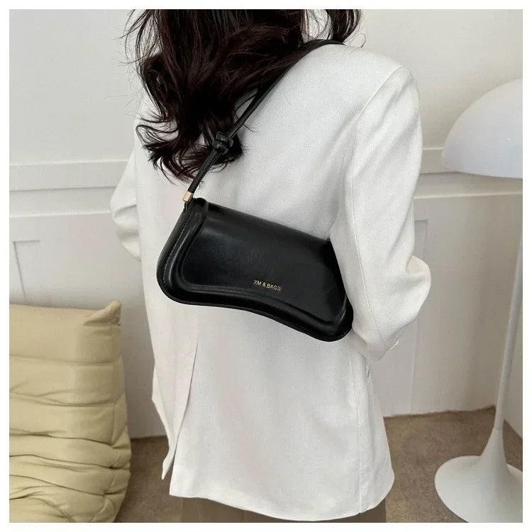 The Ivory Curve Shoulder Bag