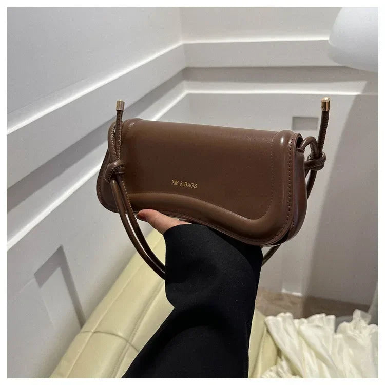 The Ivory Curve Shoulder Bag