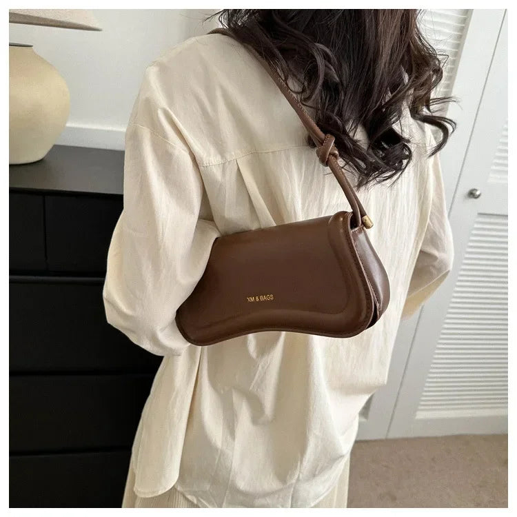 The Ivory Curve Shoulder Bag
